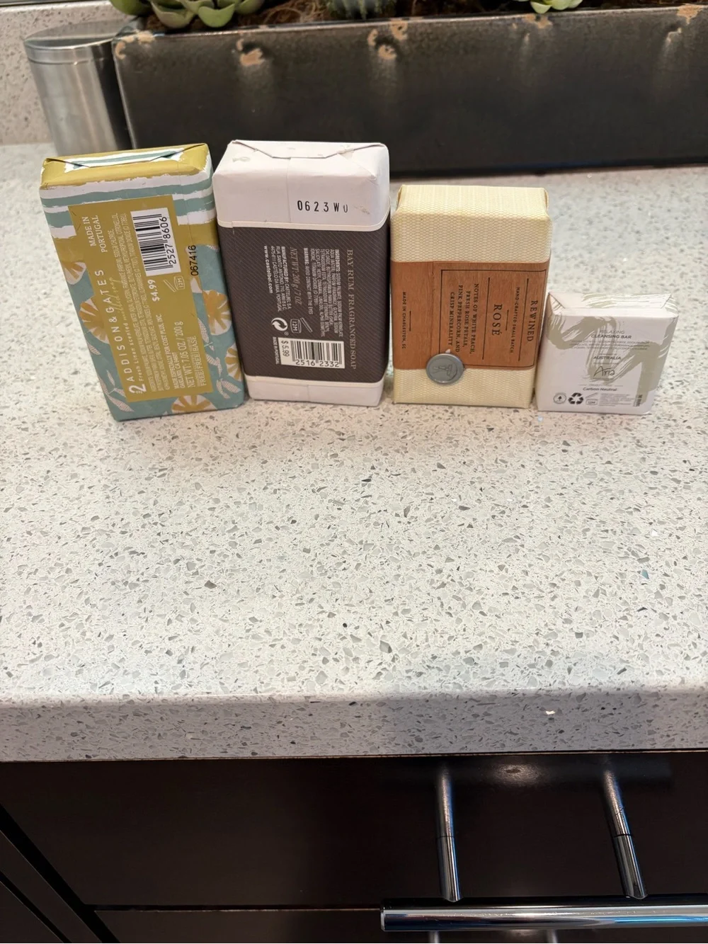 Collection of four assorted wrapped soaps